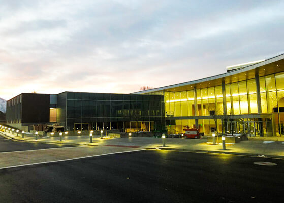 Exterior entrance view of the University's lighting during dusk