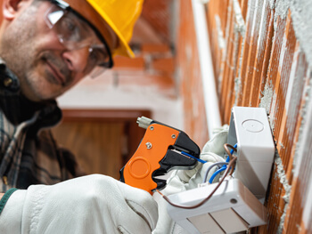 Expert technician performing emergency electrical work
